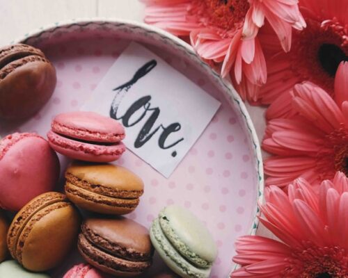 macaroons on a tray with the word 'love'