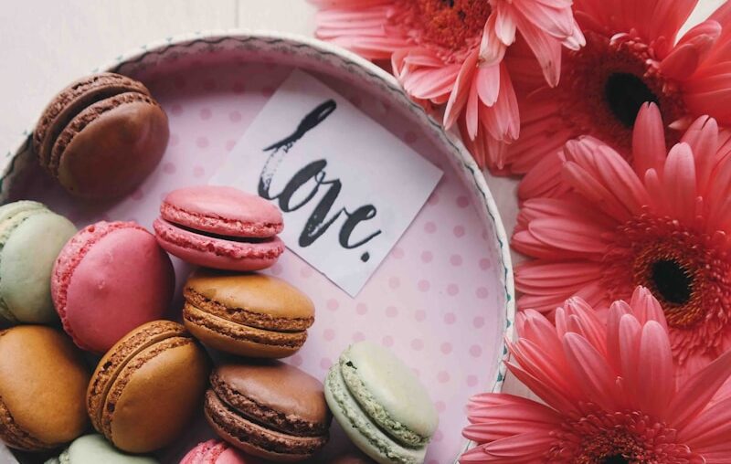 macaroons on a tray with the word 'love'