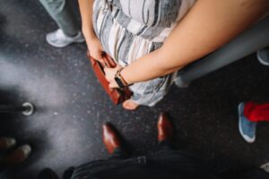 person in gray and white shirt and black pants