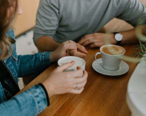 two mugs with coffee on table