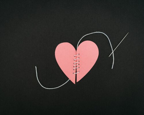 a piece of paper with a heart cut out of it